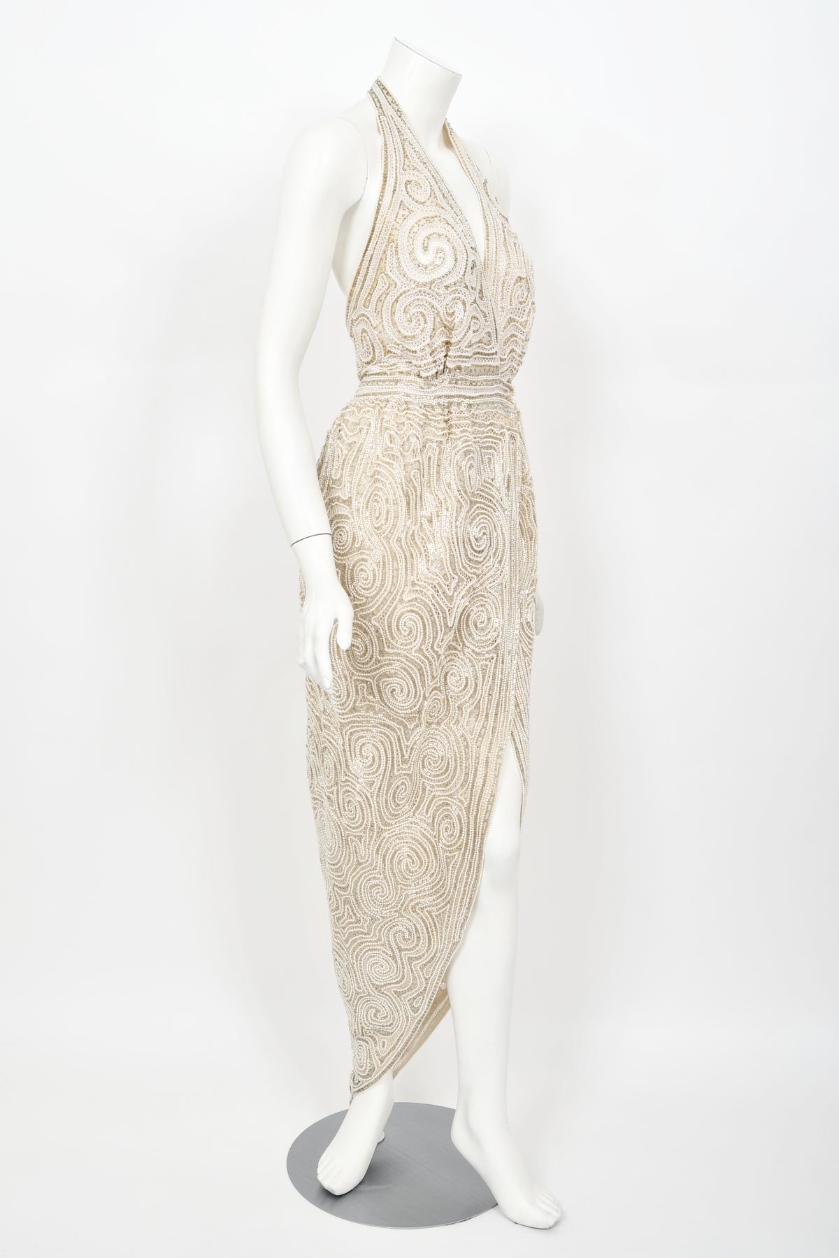 1970&#39;s Halston Couture Ivory Beaded Sheer Lace Backless Halter Wrap Gown
