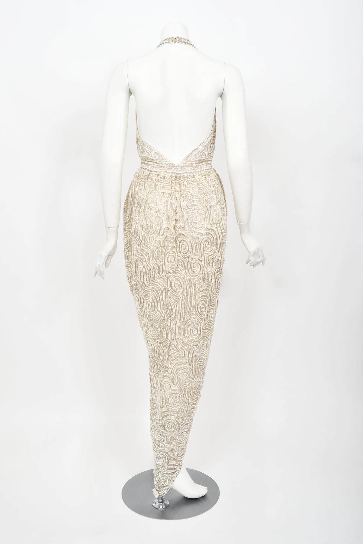 1970&#39;s Halston Couture Ivory Beaded Sheer Lace Backless Halter Wrap Gown