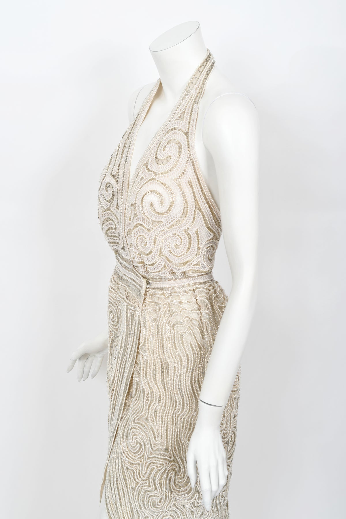 1970&#39;s Halston Couture Ivory Beaded Sheer Lace Backless Halter Wrap Gown