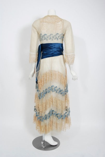 1910&#39;s Julius Garfinckel Couture Beige Embroidered Lace Blue Silk Sash Dress
